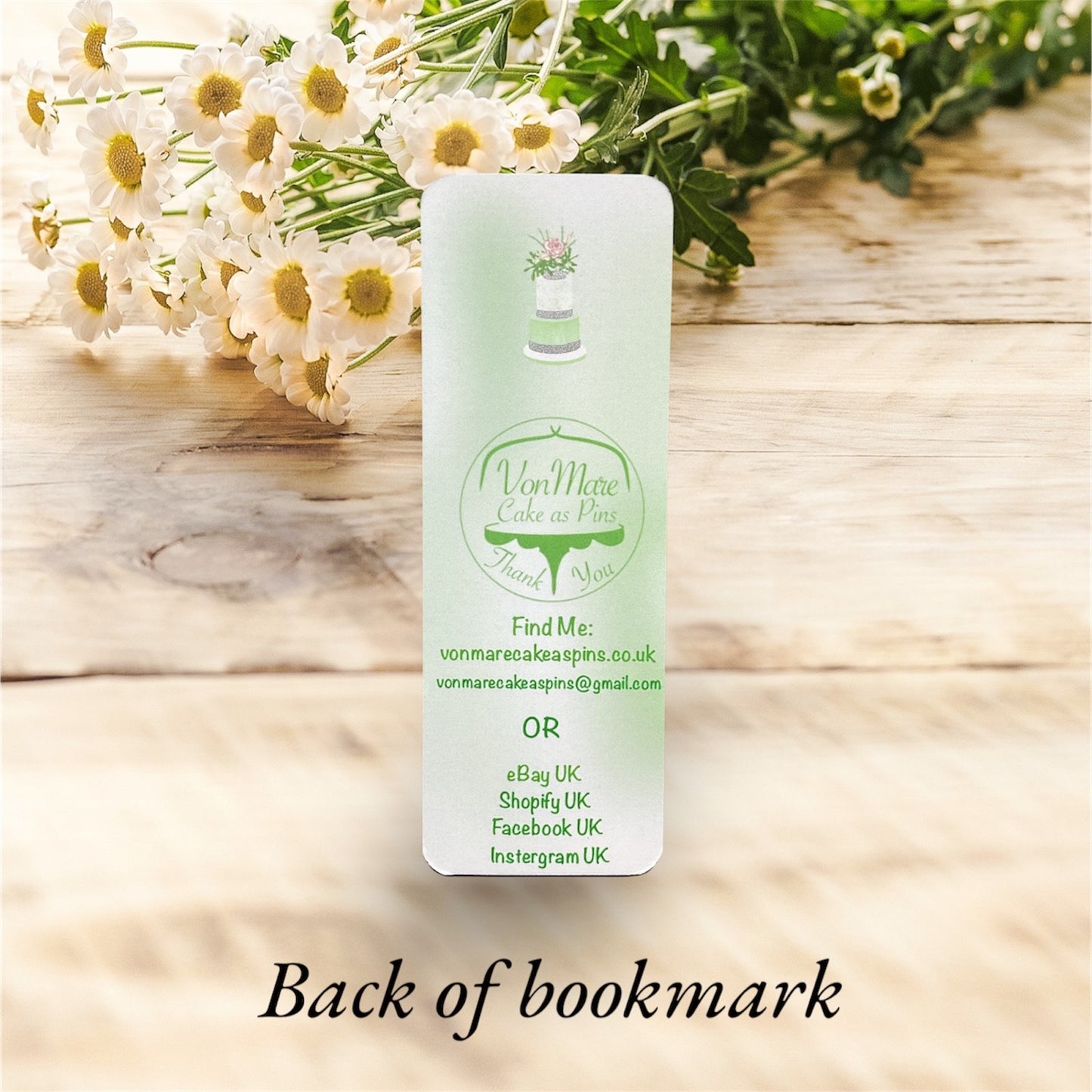 Double-sided green floral bookmark with silver accents, showing both front and back designs"