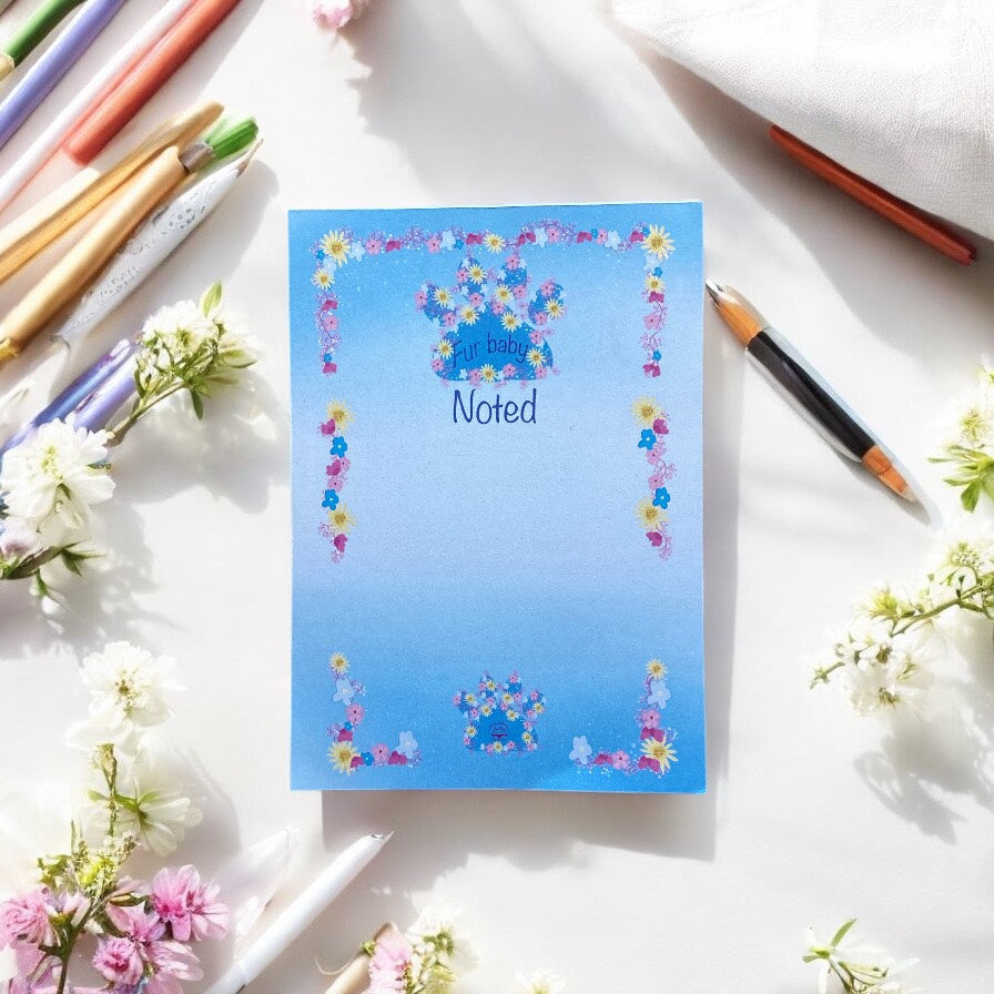 "Blue paw print A6 notepad showing inside pages with premium 120gsm paper, ideal for lists and journaling"