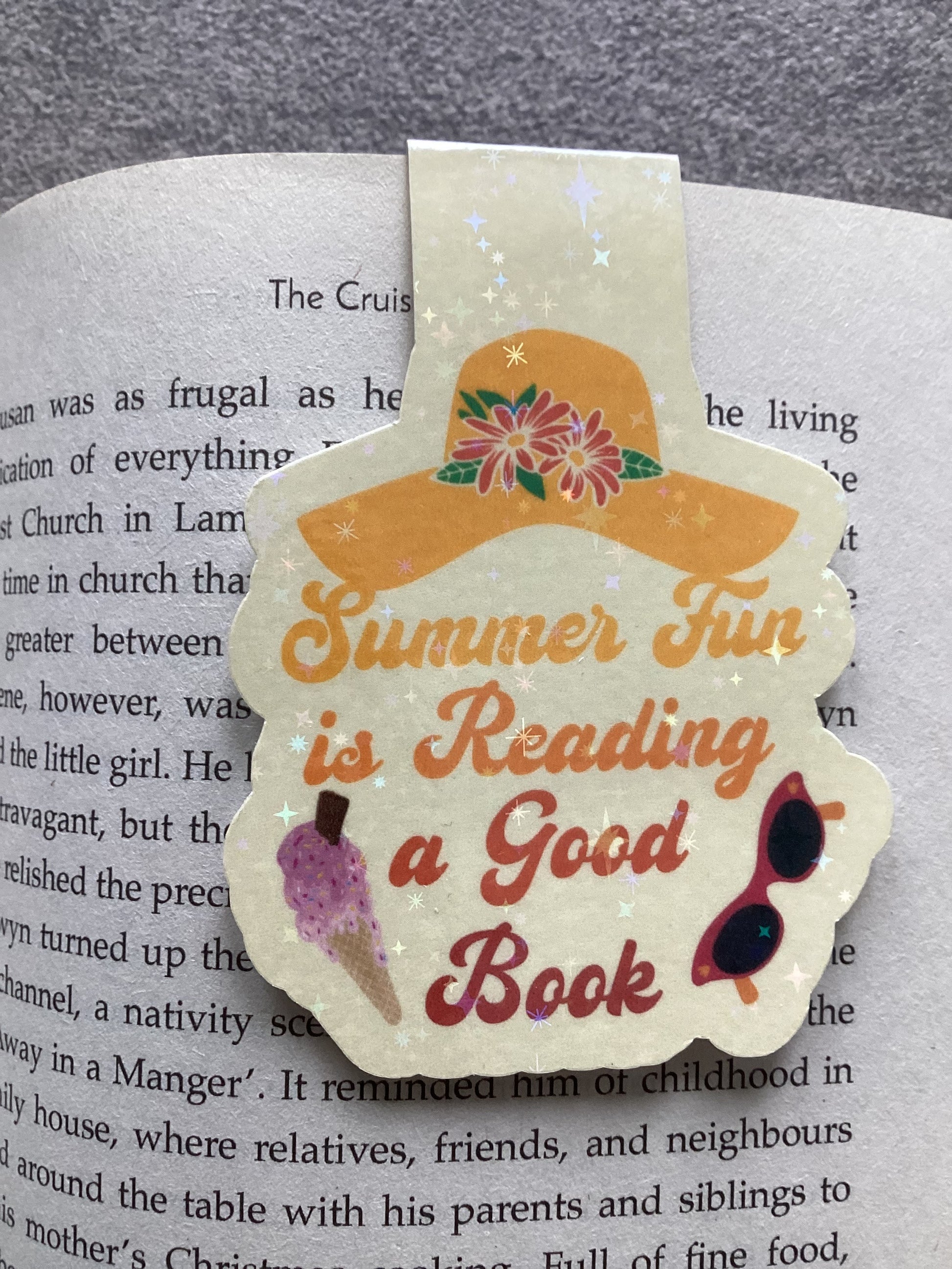"Magnetic Summer Bookmark in Use with Book - Perfect for Beach Reading with Secure Magnetic Closure"
