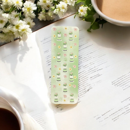 Elegant green floral bookmark with tiered cake design and silver accents, perfect for book lovers"