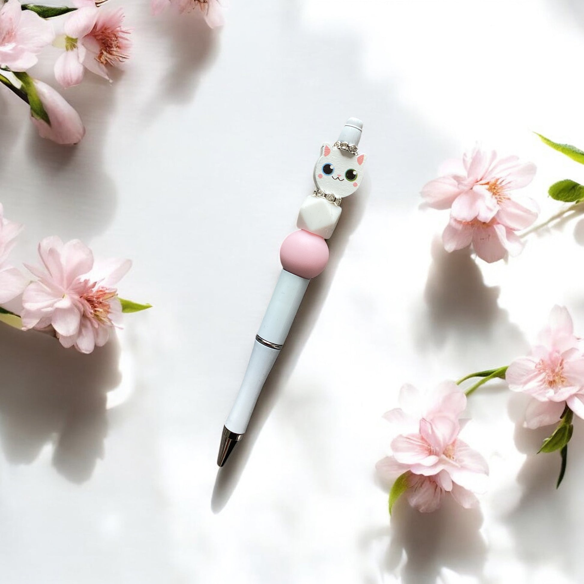 "Beaded white cat pen with pink and white beads - stylish black biro writing instrument"