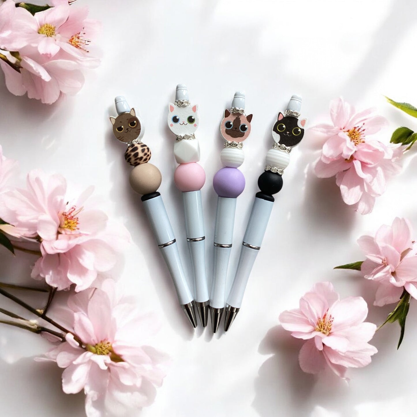 "Complete view of face cat beaded pen showing elegant designs"